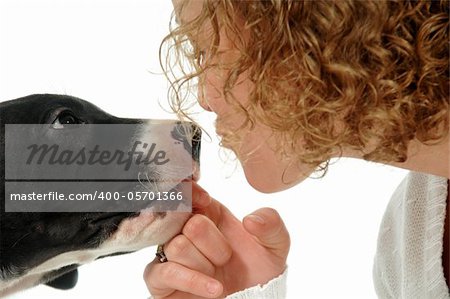 Young woman and sweet puppy close together.