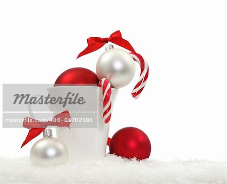 Christmas composition with candies and christmas decoration over white