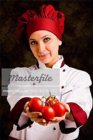 portrait photo of young female chef in front of rural background