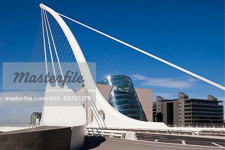 The Samuel Beckett Bridge is the newest bridge to cross the River Liffey in Dublin, Ireland. The modern structure is curved in the shape of a harp and uses cables, like a suspension bridge, to maintain the structure.