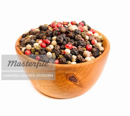 spices in a wooden platter isolated on a white backgrounds