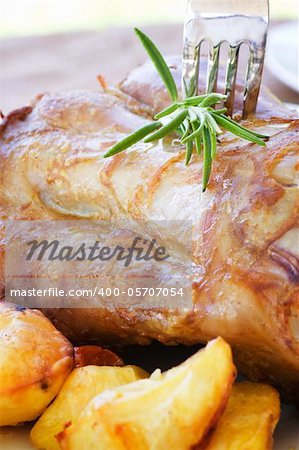 Delicious roasted and baked Veal knuckle with potatoes