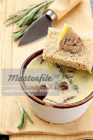 Homemade chicken liver pate on a piece of bread