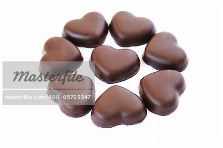 Heart shape chocolates isolated on white background.