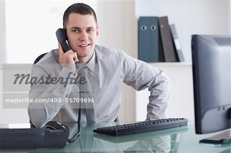 Businessman listening carefully to caller on the phone