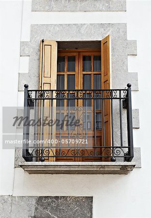 The Renovated Facade of the Old Spanish House with Balcony