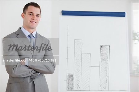 Smiling businessman confident about his diagram