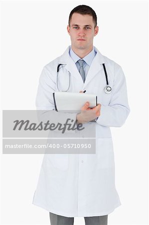 Serious looking doctor on white background