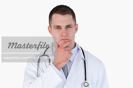 Close up of thinking doctor on white background