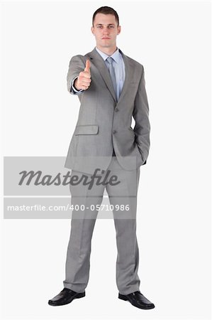 Businessman giving thump up on white background