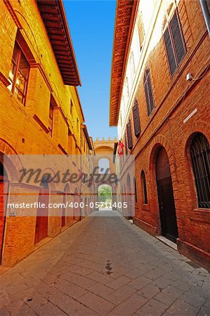 Narrow Alley With Old Buildings In Italian City of Siena