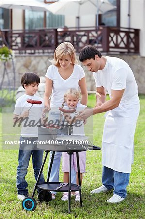 A happy family with a barbecue