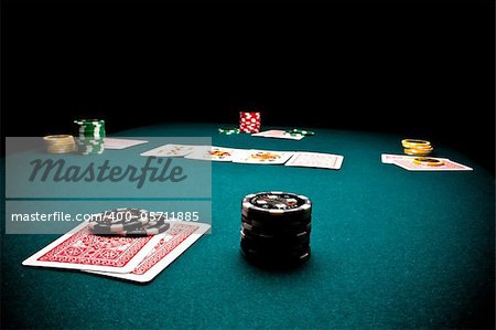 Close-up of poker players gaming table