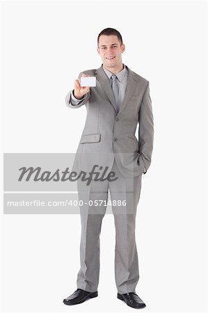 Portrait of a businessman showing a business card against a white background