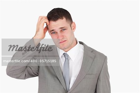 Anxious young businessman against a white background