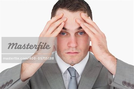 Sad young entrepreneur against a white background