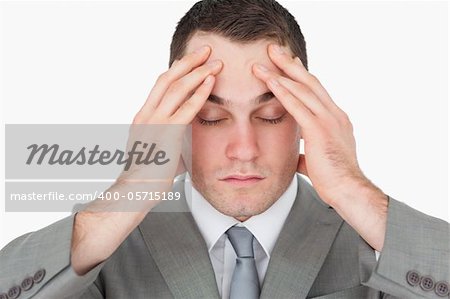 Tired young entrepreneur against a white background