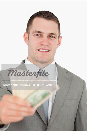Portrait of a businessman giving notes against a white background