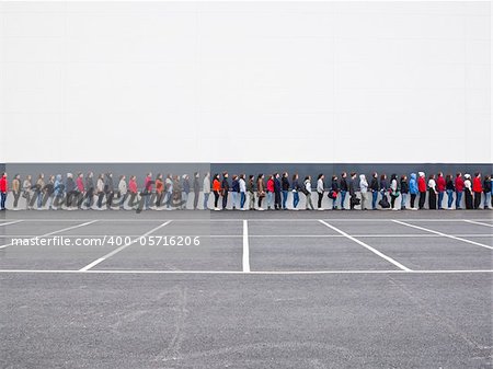 Large group of people waiting in line