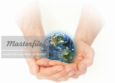 Masculine hands holding the Earth against a white background