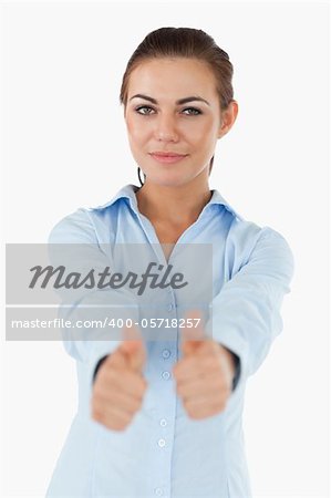 Businesswoman giving her approval against a white background