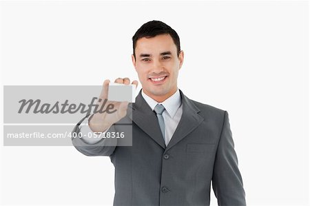 Businessman showing his businesscard against a white background