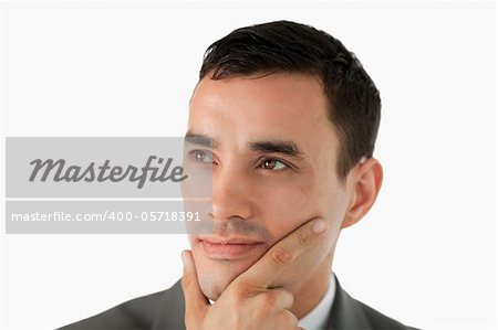 Close up of businessman having a vision against a white background