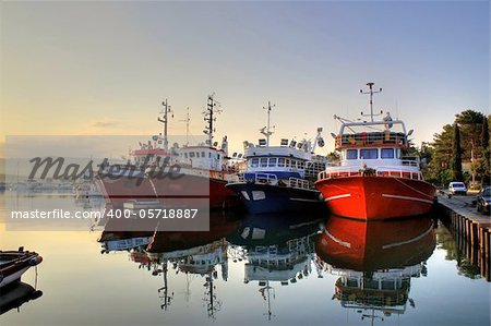 Fishing boats in harbor on early morning, calm sea, Island of Krk, Croatia