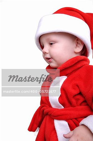 little  boy wearing a Santa Clause hat
