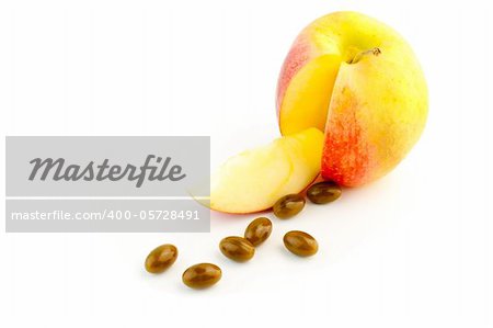 detail of pills and cutted apple