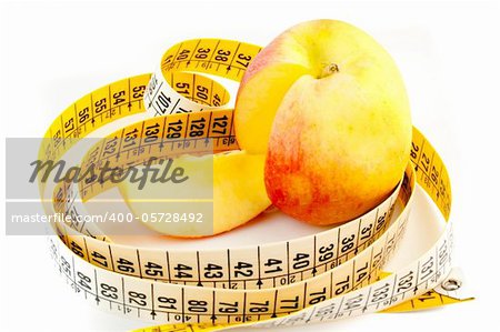 detail of cutted apple with measuring tape