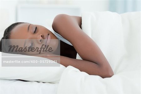 Young woman sleeping in her bedroom
