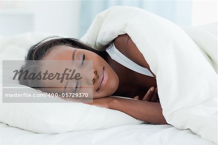 Radiant woman sleeping in her bedroom