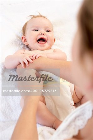 Mother Changing Baby Nappy