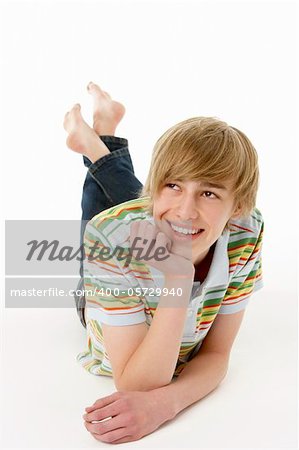 Studio Portrait Of Happy Teenage Boy