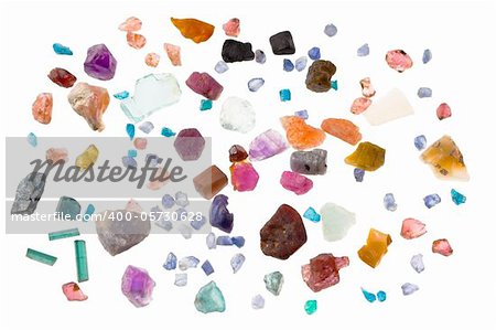 Rough precious and semi-precious stones - ruby, sapphire, emerald, tourmaline, opal, apatite, aquamarine, iolite, spinel. Isolated on white.