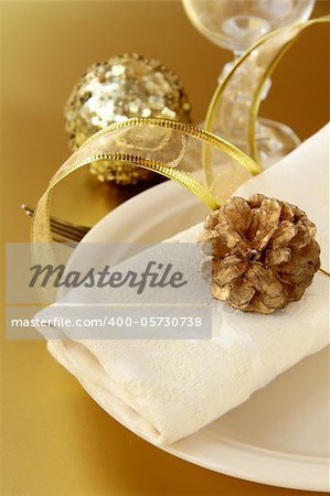 Beautiful and elegant gold place setting for christmas or celebrations