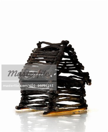 Ruined house from matches after fire Isolated on white background Emergency property insurance risky investment concept