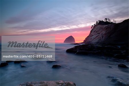 Colorful sunset in Oregon at Cape Kiwanda with long exposure