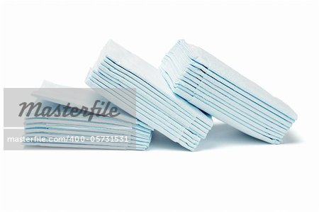 Stacks of blue folded facial tissue papers on white background