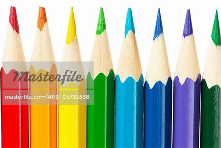 Macro view of colorful pencils isolated over white background