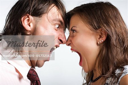 Aggression young men and woman on white background