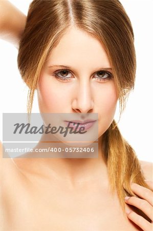 young beautiful woman holding her pigtail on white background