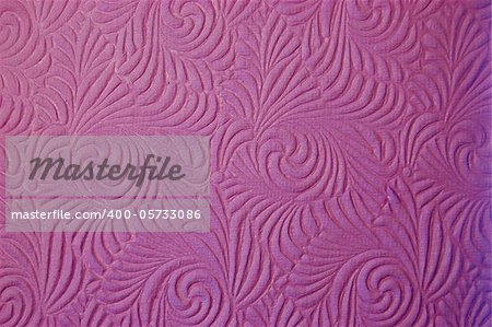 Handmade purple paper with an embossed swirl pattern