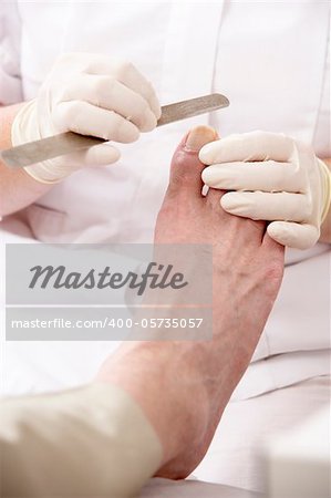 Chirpodist treating client in clinic