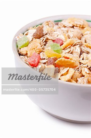 Healthy muesli in a white bowl isolated over white background