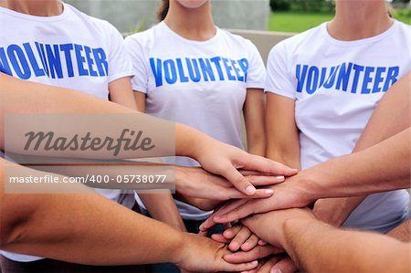 volunteer group hands together showing unity