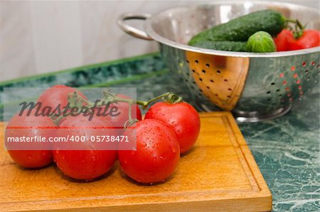 red tomato and green cucumbers