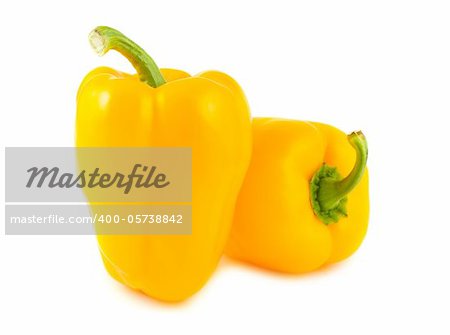 Two yellow peppers isolated on white background