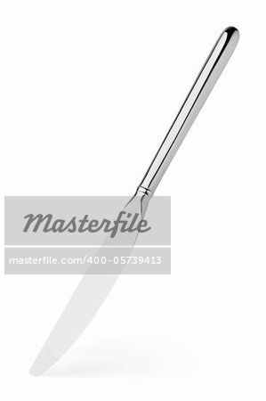 Silver knife stands vertically with shadow isolated on white